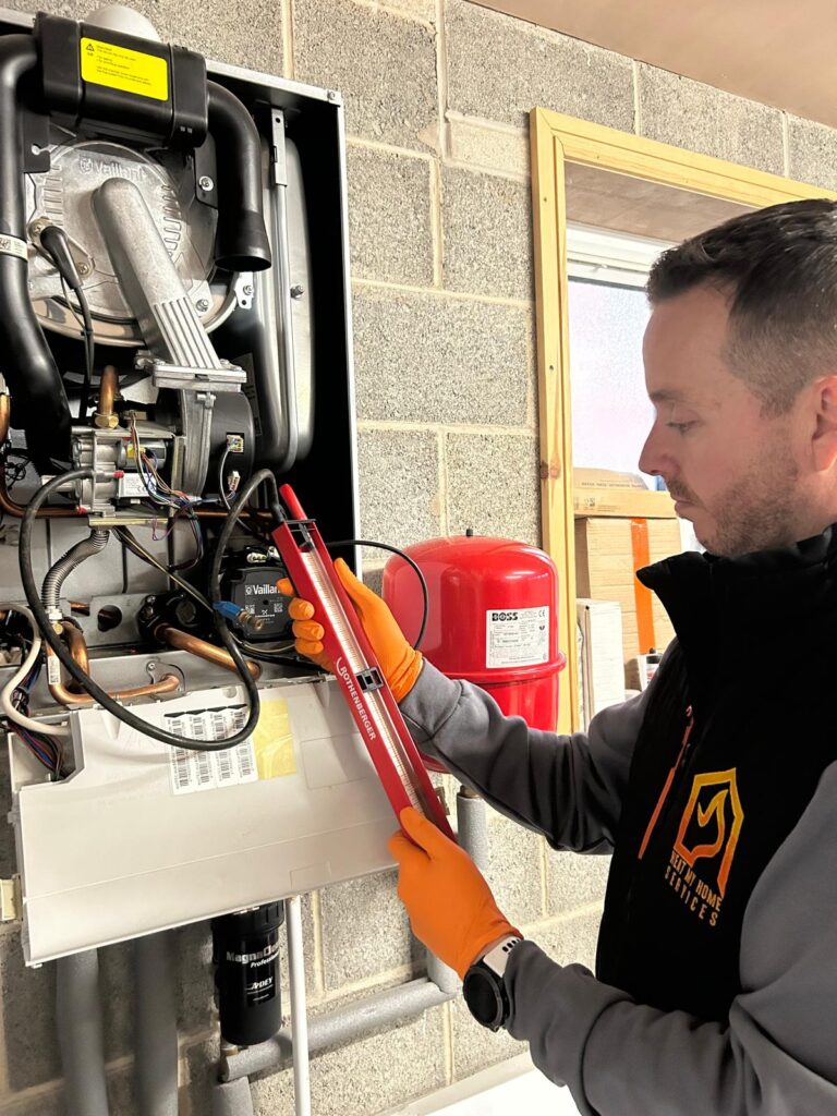 Heat My Home engineer checking a boiler