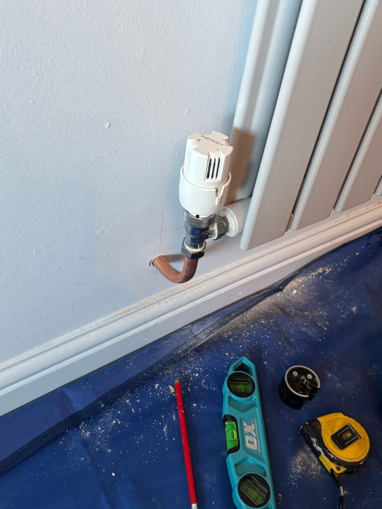 Thermostatic radiator valve connected to copper pipework