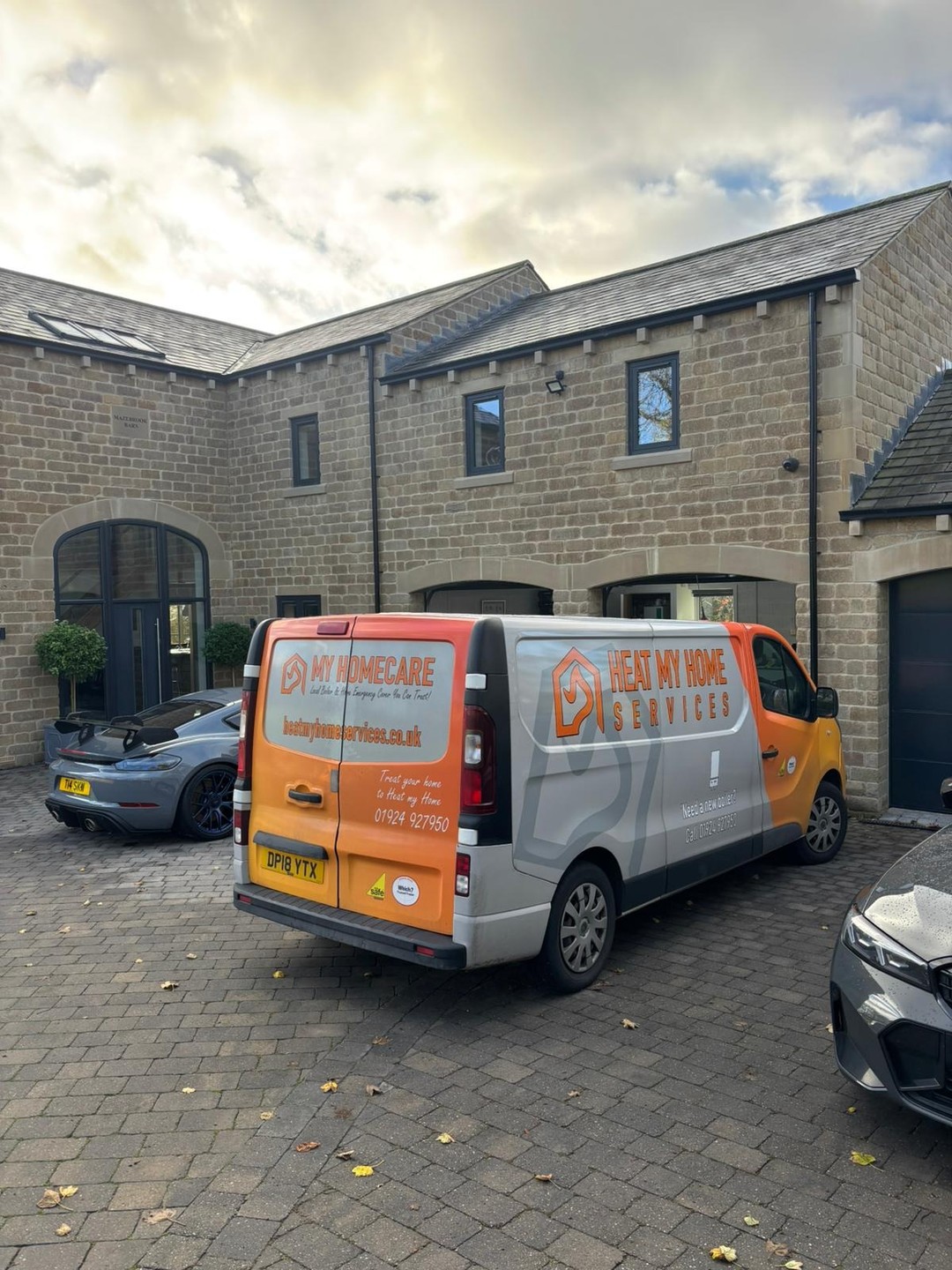 Heat My Home Services van outside a stone-built home in Cleckheaton