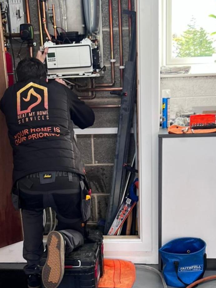 Heat My Home Services engineer carrying out a boiler service