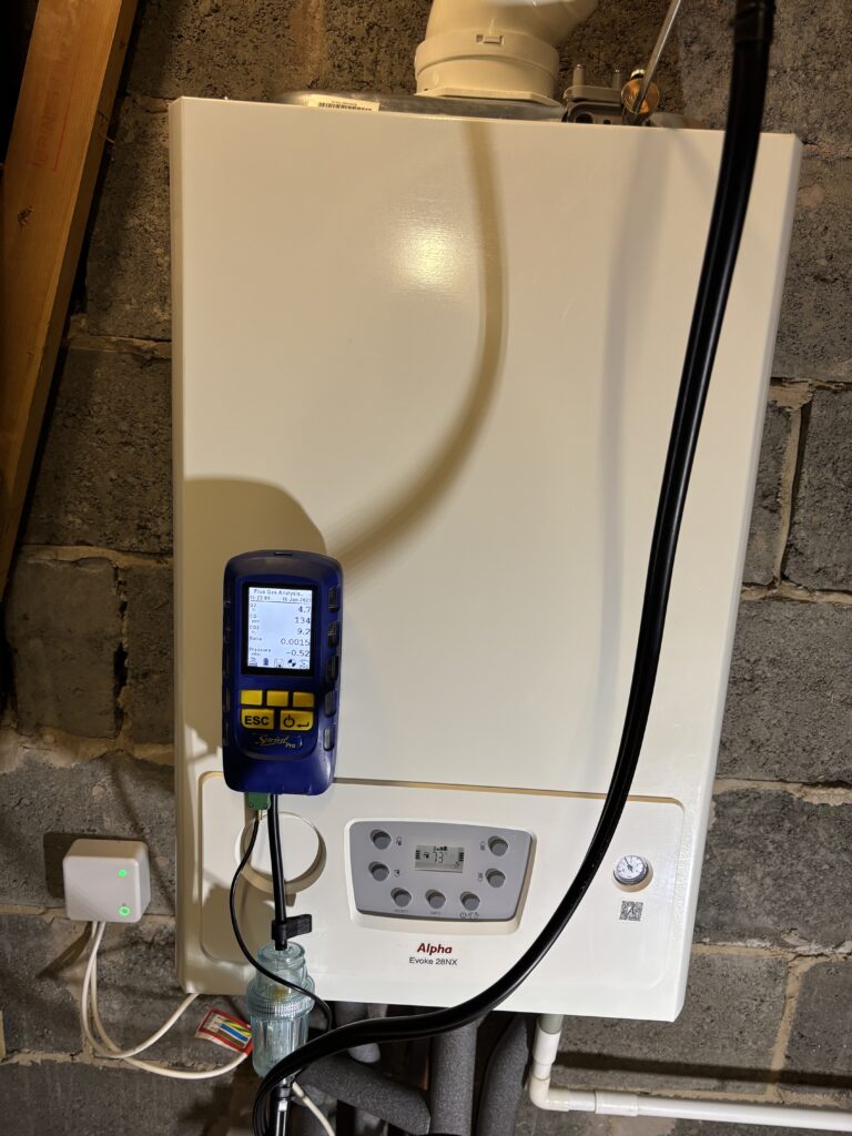 Alpha Evoke 28NX boiler installed in Tingley, connected to a flue-gas analyser